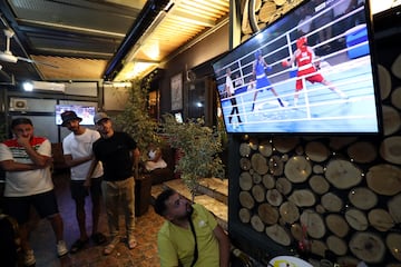 Algerian boxing fans watch the semi-final of the women's 66kg boxing competition between Khelif and Suwannapheng.