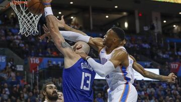 Oct 30, 2018; Oklahoma City, OK, USA; LA Clippers center Marcin Gortat (13) is fouled by Oklahoma City Thunder guard Russell Westbrook (0) on the way to the basket during the first quarter at Chesapeake Energy Arena. Mandatory Credit: Alonzo Adams-USA TODAY Sports