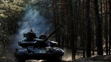 Ukrainian soldiers drive a captured Russian tank after re-fitting it for use in battle, in Kupiansk region of Kharkiv Oblast, Ukraine, October 15, 2022. REUTERS/Clodagh Kilcoyne TPX IMAGES OF THE DAY