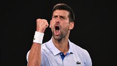 Serbia's Novak Djokovic celebrates after winning the third set against Croatia's Dino Prizmic during their men's singles match on day one of the Australian Open tennis tournament in Melbourne on January 14, 2024. (Photo by WILLIAM WEST / AFP) / -- IMAGE RESTRICTED TO EDITORIAL USE - STRICTLY NO COMMERCIAL USE --