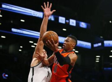 Jan 24, 2016; Brooklyn, NY, USA; Oklahoma City Thunder guard Russell Westbrook (0) drives to the basket against Brooklyn Nets center Brook Lopez (11) during first half at Barclays Center. Mandatory Credit: Noah K. Murray-USA TODAY Sports