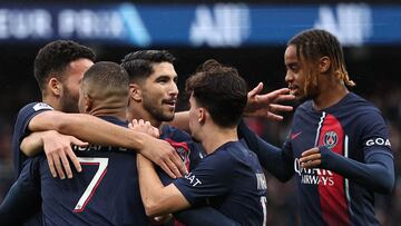 Paris Saint-Germain's French forward #07 Kylian Mbappe celebrates scoring his team's first goal during the French L1 football match between Paris Saint-Germain (PSG) and Strasbourg at the Parc des Princes stadium in Paris on October 21, 2023. (Photo by FRANCK FIFE / AFP)