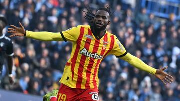Lens French defender #19 Goduine Koyalipou celebrates after scoring his team's first goal during the French L1 football match between Le Havre AC and RC Lens at The Stade Oceane in Le Havre, north-western France, on January 12, 2025. (Photo by Lou BENOIST / AFP)
