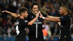 Paris Saint-Germain&#039;s Spanish defender Juan Bernat (L), Paris Saint-Germain&#039;s Uruguayan forward Edinson Cavani and Paris Saint-Germain&#039;s French forward Kylian Mbappe react following a goal during their UEFA Champions&#039; League football m