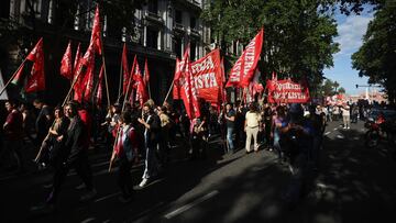 Demonstrators hold flags reading "Socialist left" as they take part in a protest against Argentina's new President Javier Milei's adjustment policy, near the Casa Rosada Presidential Palace, in Buenos Aires, Argentina December 20, 2023. REUTERS/Agustin Marcarian