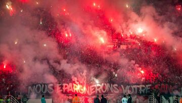 Wydad supporters light flares 