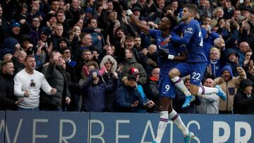 Chelsea's English striker Tammy Abraham (L) with Chelsea's US midfielder Christian Pulisic celebrates after he scores his team's first goal during the English Premier League football match between Chelsea and Crystal Palace at Stamford Bri