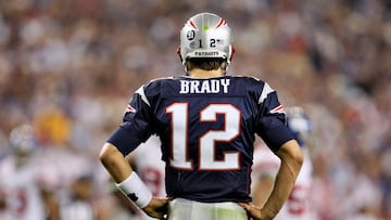 FILE PHOTO: New England Patriots quarterback Tom Brady watches the New York Giants celebrate their upset win at game&#039;s end in the NFL&#039;s Super Bowl XLII football game in Glendale, Arizona, February 3, 2008. The Giants beat the undefeated Patriots