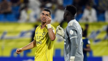 Soccer Football - Saudi Pro League - Al Hazem v Al Nassr - King Abdullah Sport City Stadium, Buraydah, Saudi Arabia - October 25, 2025 Al Nassr's Cristiano Ronaldo speaks to Al Hazem's Bruno Varela during the match REUTERS/Stringer
