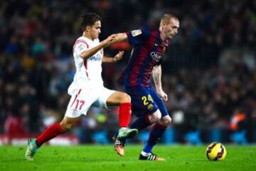 Jeremy Mathieu del Barcelona y Denis Suarez del Sevilla