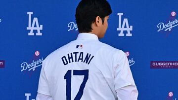 Japanese baseball player Shohei Ohtani poses during a press conference on his presentation after signing a ten-year deal with the Los Angeles Dodgers at Dodgers Stadium in Los Angeles, California on December 14, 2023. Ohtani has signed a record-shattering $700 million deal with the Los Angeles Dodgers, the richest in North American sports history. (Photo by Frederic J. Brown / AFP)