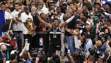 Jul 20, 2021; Milwaukee, Wisconsin, USA; Milwaukee Bucks forward Giannis Antetokounmpo (34) celebrates with the NBA Finals MVP Trophy following the game against the Phoenix Suns following game six of the 2021 NBA Finals at Fiserv Forum. Mandatory Credit: Jeff Hanisch-USA TODAY Sports