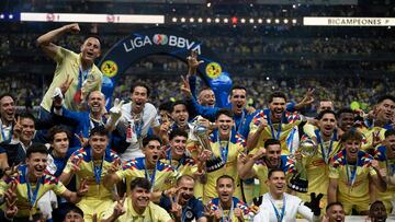 America's players celebrate with the trophy after defeating Cruz Azul in the Mexican Clausura tournament second leg final football match between America and Cruz Azul at the Azteca stadium in Mexico City, on May 26, 2024. (Photo by Yuri CORTEZ / AFP)