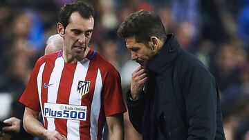 Godín, con Simeone.