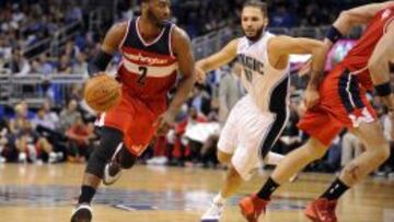 John Wall bota ante Evan Fournier.