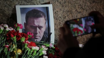 Flowers placed next to a portrait of Russian opposition leader Alexei Navalny at the monument to the victims of political repressions following Navalny's death, in Saint Petersburg, Russia February 16, 2024. REUTERS/Stringer