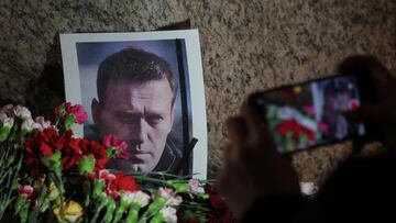 Flowers placed next to a portrait of Russian opposition leader Alexei Navalny at the monument to the victims of political repressions following Navalny's death, in Saint Petersburg, Russia February 16, 2024. REUTERS/Stringer
