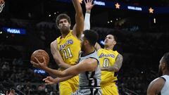 Mar 3, 2018; San Antonio, TX, USA; San Antonio Spurs forward Kyle Anderson (1) passes around Los Angeles Lakers center Brook Lopez (11) and forward Kyle Kuzma (0) during the first half at the AT&amp;T Center. Mandatory Credit: Brendan Maloney-USA TODAY Sports