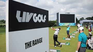 Players practice on the driving range ahead of ahead of the forthcoming LIV Golf Invitational Series event at The Centurion Club in St Albans, north of London, on June 7, 2022. - Former world number one golfer Dustin Johnson confirmed on Tuesday he has resigned his membership of the US PGA Tour to play in the breakaway LIV Golf Invitational Series. The decision effectively rules the American two-time major winner out of participating in the Ryder Cup, which pits the United States against Europe every two years. Six-time major winner Phil Mickelson confirmed on Monday he had also signed up to play in the inaugural LIV event in a major coup for the organisers. (Photo by ADRIAN DENNIS / AFP) (Photo by ADRIAN DENNIS/AFP via Getty Images)