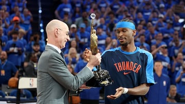 OKLAHOMA CITY, OKLAHOMA - MAY 22: Commissioner of the NBA Adam Silver presents Shai Gilgeous-Alexander #2 of the Oklahoma City Thunder with the MVP Michael Jordan Trophy prior to a game against the Minnesota Timberwolves in Game Two of the Western Conference Finals of the 2025 NBA Playoffs at Paycom Center on May 22, 2025 in Oklahoma City, Oklahoma. NOTE TO USER: User expressly acknowledges and agrees that, by downloading and or using this photograph, User is consenting to the terms and conditions of the Getty Images License Agreement. Matthew Stockman/Getty Images/AFP (Photo by MATTHEW STOCKMAN / GETTY IMAGES NORTH AMERICA / Getty Images via AFP)