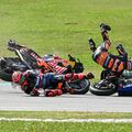 Monster Energy Yamaha MotoGP's French rider Fabio Quartararo (L) and Red Bull KTM Factory's South African rider Brad Binder (R) fall after a collision during the MotoGP Malaysian Grand Prix at the Sepang International Circuit in Sepang on November 3, 2024. (Photo by MOHD RASFAN / AFP)