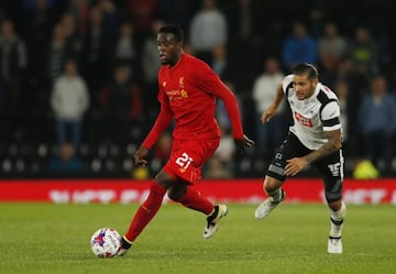 Divock Origi in action with Derby's Bradley Johnson