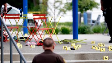 Evidence markers indicate the position of spent shell casings following a mass shooting at the Brooklands Plaza Splash Pad in Rochester Hills, Michigan, U.S. June 15, 2024.  Eric Seals/USA Today Network via REUTERS.   NO RESALES. NO ARCHIVES. MANDATORY CREDIT