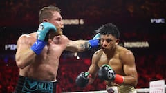 LAS VEGAS, NEVADA - MAY 04: Canelo Alvarez lands a left against Jaime Munguia in their super middleweight championship title fight at T-Mobile Arena on May 04, 2024 in Las Vegas, Nevada.   Christian Petersen/Getty Images/AFP (Photo by Christian Petersen / GETTY IMAGES NORTH AMERICA / Getty Images via AFP)