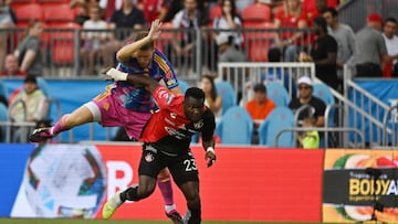 Jul 30, 2023; Toronto, Ontario, CAN; Atlas forward Jordy Caicedo (23) plays the ball defended by Toronto FC defender Sigurd Rosted (17) in the first half at BMO Field. Mandatory Credit: Dan Hamilton-USA TODAY Sports