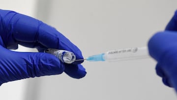 A medical worker prepares a dose of the Sputnik V vaccine against the Covid-19 at the Boris Trajkovski sports hall in Skopje as the country start its vaccination campaign, after months of difficulties on April 16, 2021. - Moscow announced on April 14, 202