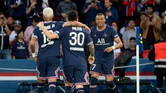 PARIS, FRANCE - MAY 21: Kylian Mbappe of PSG celebrates his second goal with Neymar Jr, Lionel Messi of PSG during the Ligue 1 Uber Eats match between Paris Saint-Germain (PSG) and FC Metz at Parc des Princes stadium on May 21, 2022 in Paris, France. (Photo by John Berry/Getty Images)