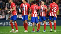 Atletico Madrid players celebrate their win at the end of the Spanish Liga football match between Club Atletico de Madrid and Cadiz CF at the Metropolitano stadium in Madrid on October 1, 2023. (Photo by JAVIER SORIANO / AFP)