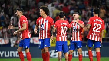 Atletico Madrid players celebrate their win at the end of the Spanish Liga football match between Club Atletico de Madrid and Cadiz CF at the Metropolitano stadium in Madrid on October 1, 2023. (Photo by JAVIER SORIANO / AFP)