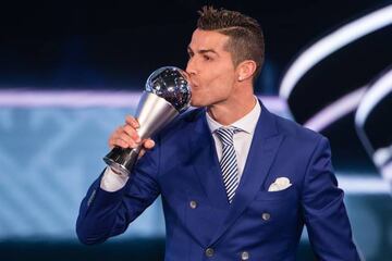 Cristiano Ronaldo kisses The Best FIFA Men's Player Award during the ceremony in Zurich.