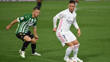 MADRID, SPAIN - APRIL 24: Eden Hazard of Real Madrid  is put under pressure by Guido Rodriguez of Real Betis  during the La Liga Santander match between Real Madrid and Real Betis at Estadio Santiago Bernabeu on April 24, 2021 in Madrid, Spain. Sporting s