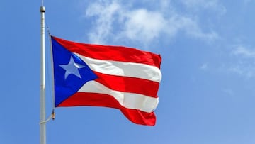 The flag of Puerto Rico flies.