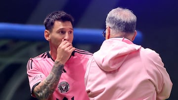 Inter Miami's Argentine forward #10 Lionel Messi speaks with his Argentine coach Gerardo Martino as he exits the pitch during the friendly exhibition match between Saudi Arabia's al-Hilal SFC and the US Inter Miami CF at the Kingdom Arena Stadium in Riyadh on January 29, 2024. (Photo by Fayez NURELDINE / AFP)