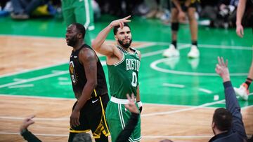 Boston Celtics forward Jayson Tatum (0) reacts after his three point basket against the Golden State Warriors in overtime at TD Garden.