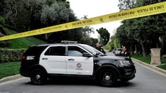 Aerial images seemed to show sons Justin and King in handcuffs, as federal agents searched their father’s home in Los Angeles.