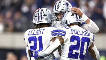 ARLINGTON, TEXAS - OCTOBER 23: Dak Prescott #4 of the Dallas Cowboys celebrates with Ezekiel Elliott #21 and Tony Pollard #20 after a touchdown against the Detroit Lions during the fourth quarter at AT&T Stadium on October 23, 2022 in Arlington, Texas. Tom Pennington/Getty Images/AFP