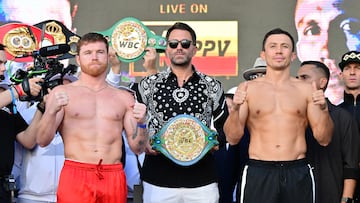 Mexican boxer Saul Alvarez (L) and Kazakh boxer Gennady Golovkin (R) pose for pictures during they weigh in on September 16, 2022 in Las Vegas, Nevada, one day ahead of their super-middleweight title bout. (Photo by Frederic J. Brown / AFP)