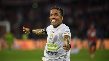 Once Caldas' forward Dayro Moreno celebrates after scoring a goal during the Primera Liga football match tournament between Independiente Medell�n and Once Caldas in Medell�n, Colombia, on March 16, 2024. Colombia's forward Dayro Moreno became the top scorer in the history of Colombian professional football by scoring his 225th goal during the match against Deportivo Independiente Medell�n. This new achievement placed Moreno above Argentine forward Sergio Galv�n Rey, who held the previous record for more than a decade.� (Photo by Jaime SALDARRIAGA / AFP)