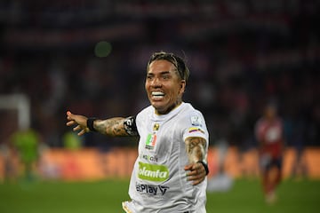 Once Caldas' forward Dayro Moreno celebrates after scoring a goal during the Primera Liga football match tournament between Independiente Medell�n and Once Caldas in Medell�n, Colombia, on March 16, 2024. Colombia's forward Dayro Moreno became the top scorer in the history of Colombian professional football by scoring his 225th goal during the match against Deportivo Independiente Medell�n. This new achievement placed Moreno above Argentine forward Sergio Galv�n Rey, who held the previous record for more than a decade.� (Photo by Jaime SALDARRIAGA / AFP)