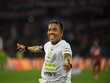 Once Caldas' forward Dayro Moreno celebrates after scoring a goal during the Primera Liga football match tournament between Independiente Medell�n and Once Caldas in Medell�n, Colombia, on March 16, 2024. Colombia's forward Dayro Moreno became the top scorer in the history of Colombian professional football by scoring his 225th goal during the match against Deportivo Independiente Medell�n. This new achievement placed Moreno above Argentine forward Sergio Galv�n Rey, who held the previous record for more than a decade.� (Photo by Jaime SALDARRIAGA / AFP)