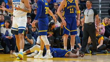 Mar 26, 2023; San Francisco, California, USA;  Golden State Warriors forward Draymond Green (23) lays on the ground after being fouled against the Minnesota Timberwolves during the third quarter at Chase Center. Mandatory Credit: Neville E. Guard-USA TODAY Sports