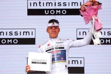 Soudal - Quick Step's Belgian rider Remco Evenepoel celebrates his Maglia Bianca on the podium at the end of the third stage of the Giro d'Italia 2023 cycling race, 216 km between Vasto and Melfi, on May 8, 2023. (Photo by Luca Bettini / AFP)