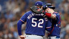 ST PETERSBURG, FLORIDA - OCTOBER 03: Jordan Montgomery #52 speaks with Jonah Heim #28 of the Texas Rangers during Game One of the Wild Card Series against the Tampa Bay Rays at Tropicana Field on October 03, 2023 in St Petersburg, Florida.   Megan Briggs/Getty Images/AFP (Photo by Megan Briggs / GETTY IMAGES NORTH AMERICA / Getty Images via AFP)