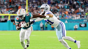 MIAMI GARDENS, FLORIDA - DECEMBER 24: Tyreek Hill #10 of the Miami Dolphins is tackled by Stephon Gilmore #21 of the Dallas Cowboys during the second quarter at Hard Rock Stadium on December 24, 2023 in Miami Gardens, Florida. Stacy Revere/Getty Images/AFP (Photo by Stacy Revere / GETTY IMAGES NORTH AMERICA / Getty Images via AFP)