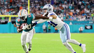 MIAMI GARDENS, FLORIDA - DECEMBER 24: Tyreek Hill #10 of the Miami Dolphins is tackled by Stephon Gilmore #21 of the Dallas Cowboys during the second quarter at Hard Rock Stadium on December 24, 2023 in Miami Gardens, Florida.   Stacy Revere/Getty Images/AFP (Photo by Stacy Revere / GETTY IMAGES NORTH AMERICA / Getty Images via AFP)