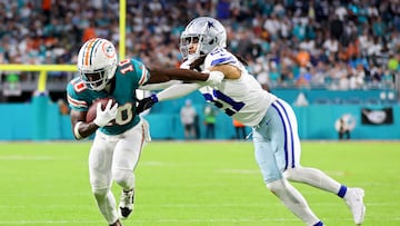 MIAMI GARDENS, FLORIDA - DECEMBER 24: Tyreek Hill #10 of the Miami Dolphins is tackled by Stephon Gilmore #21 of the Dallas Cowboys during the second quarter at Hard Rock Stadium on December 24, 2023 in Miami Gardens, Florida.   Stacy Revere/Getty Images/AFP (Photo by Stacy Revere / GETTY IMAGES NORTH AMERICA / Getty Images via AFP)